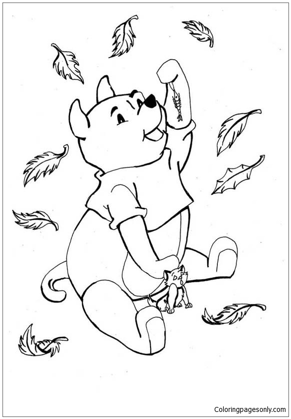 Маленький медвежонок с осенними листьями