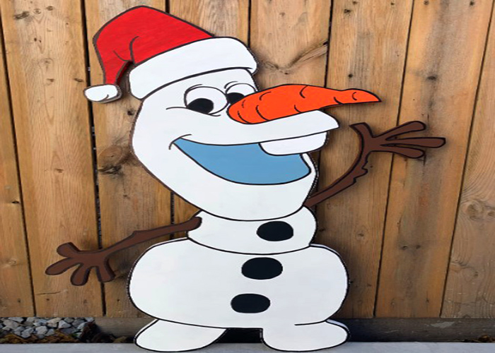 Decorating Olaf with Christmas Accessories